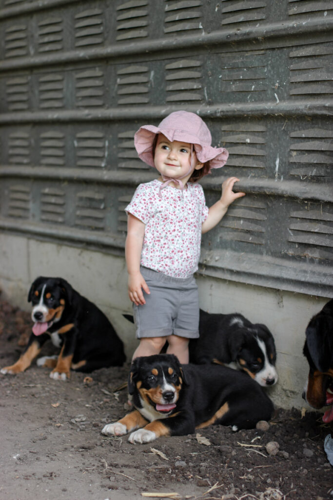 Our daughter Alaya, with the puppies